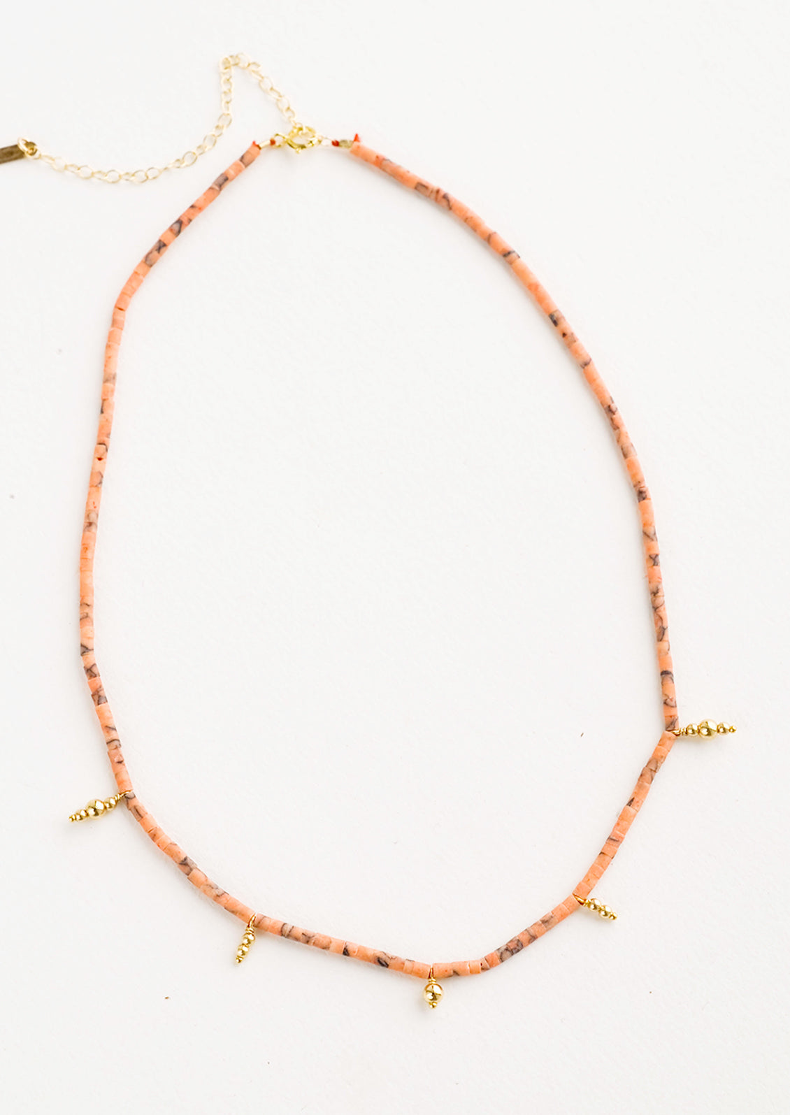 Beaded necklace with small peach and gold beads
